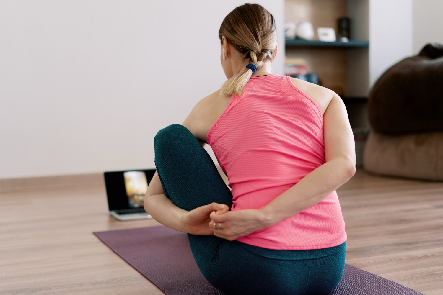 authentic woman practicing yoga home