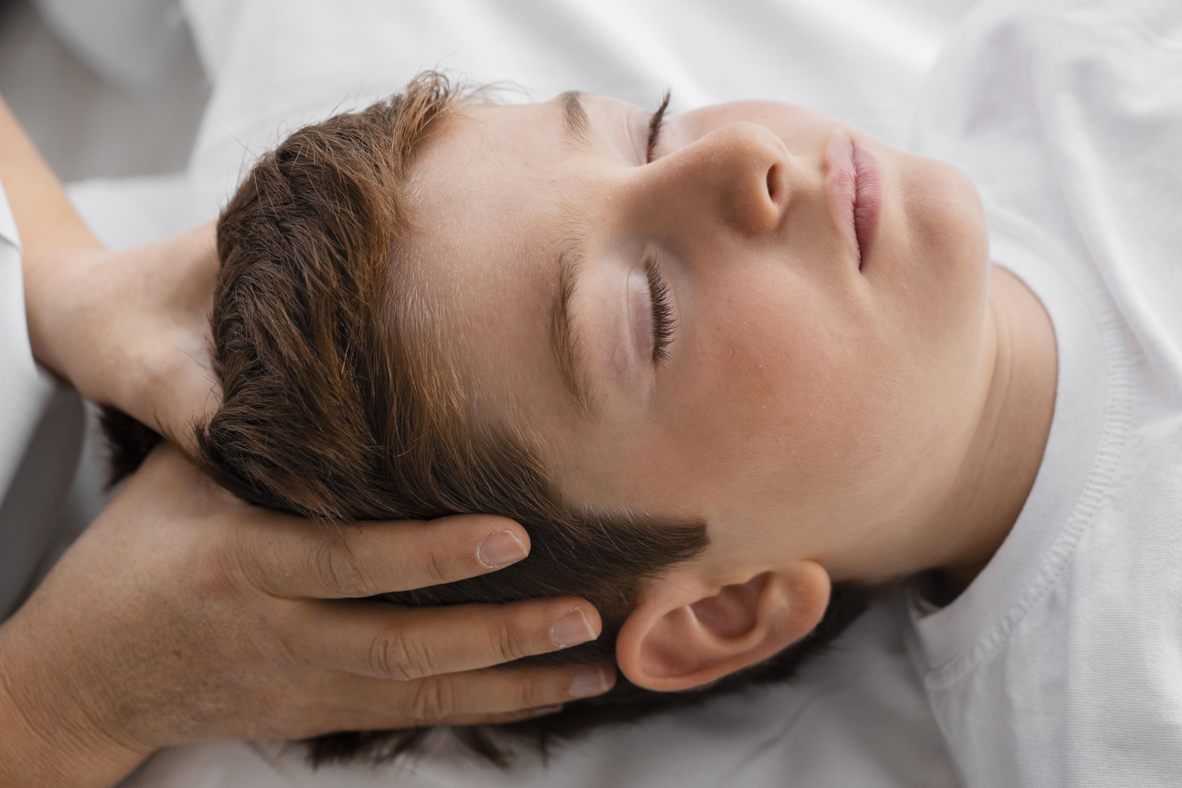osteopathist treating boy hospital